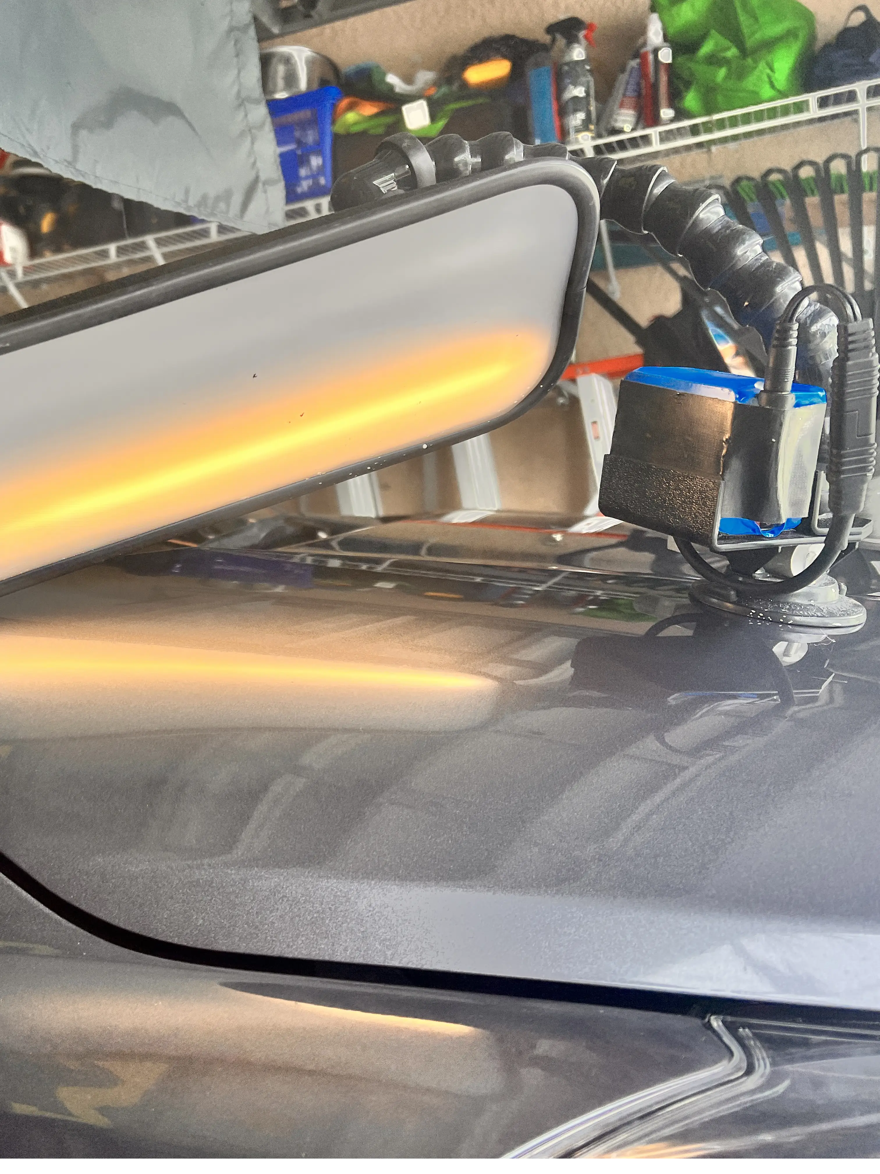 The surface of the hood of a grey vehicle is shined on after repairs were made.